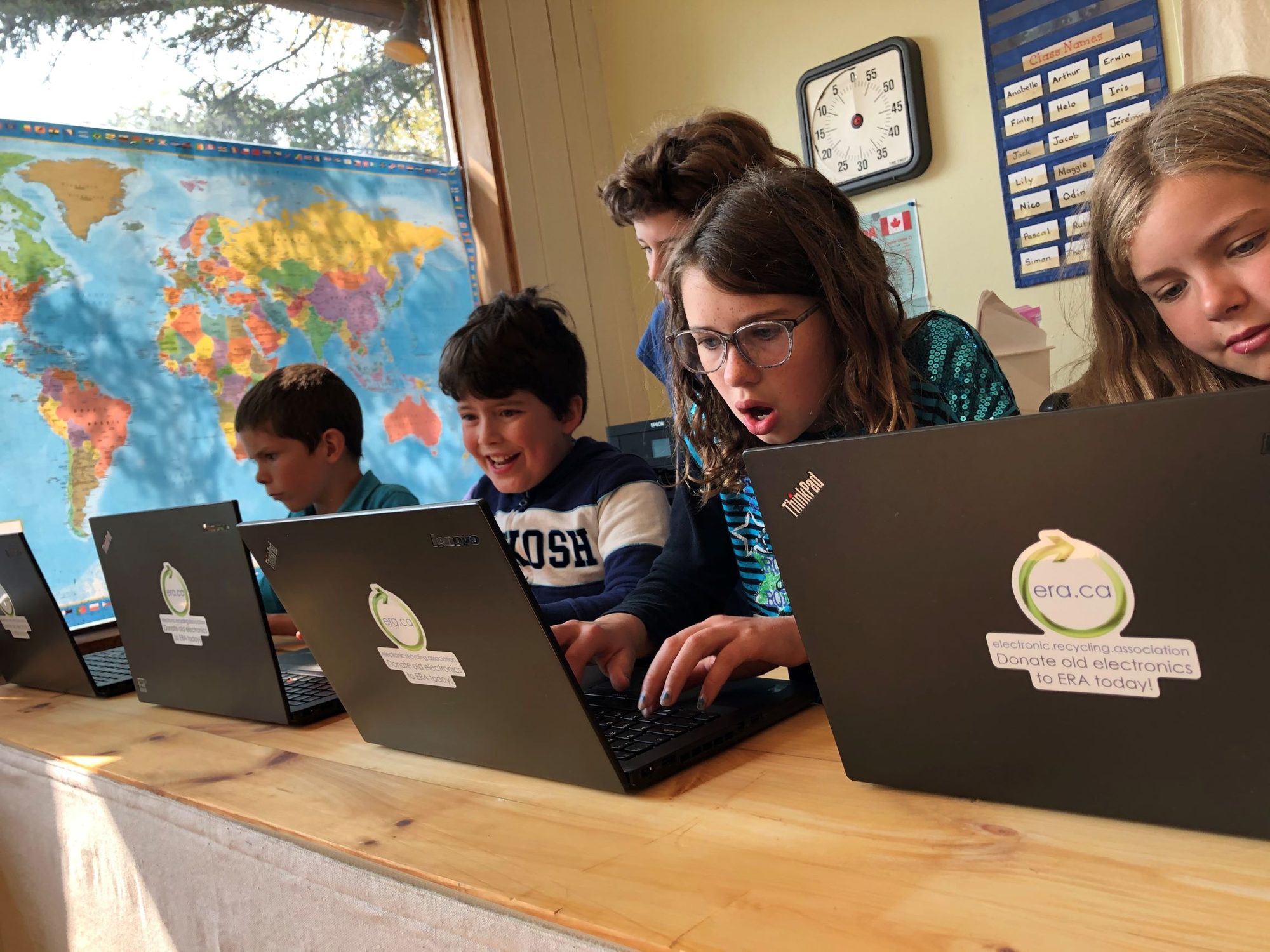Students learning together on refurbished ERA laptops