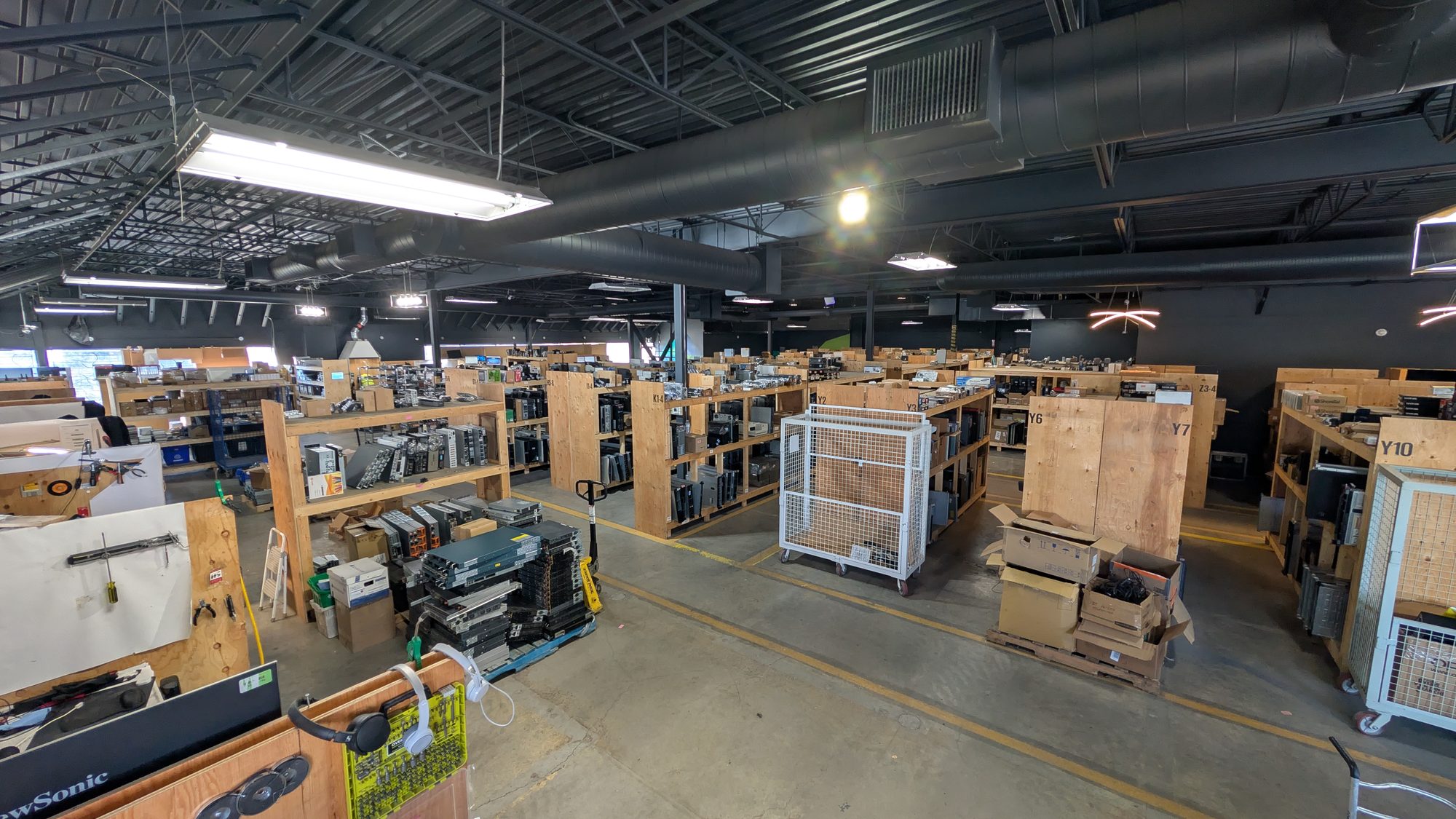 Organised rows of refurbished computers and equipment inside an ERA network facility