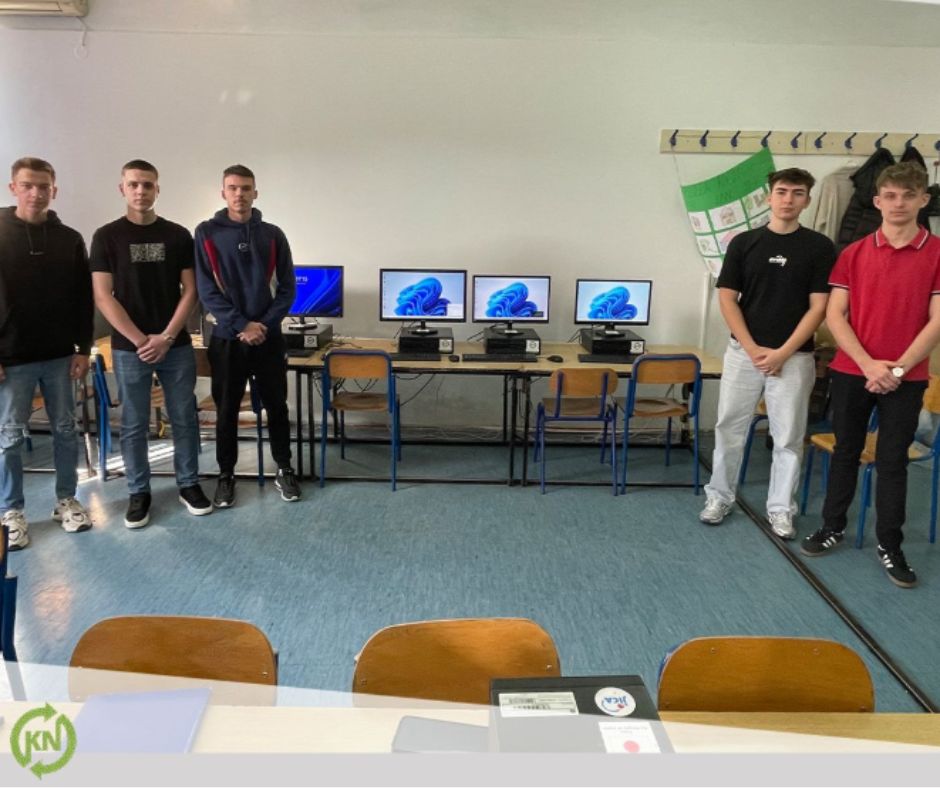 Students beside refurbished computers in a school lab in Bosnia and Herzegovina