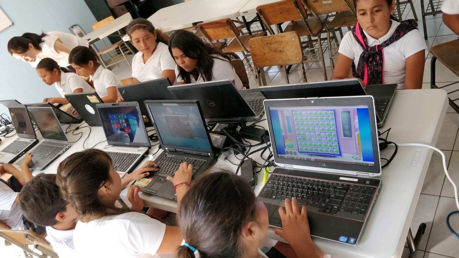 Students using donated laptops in a classroom in Jalisco, Mexico