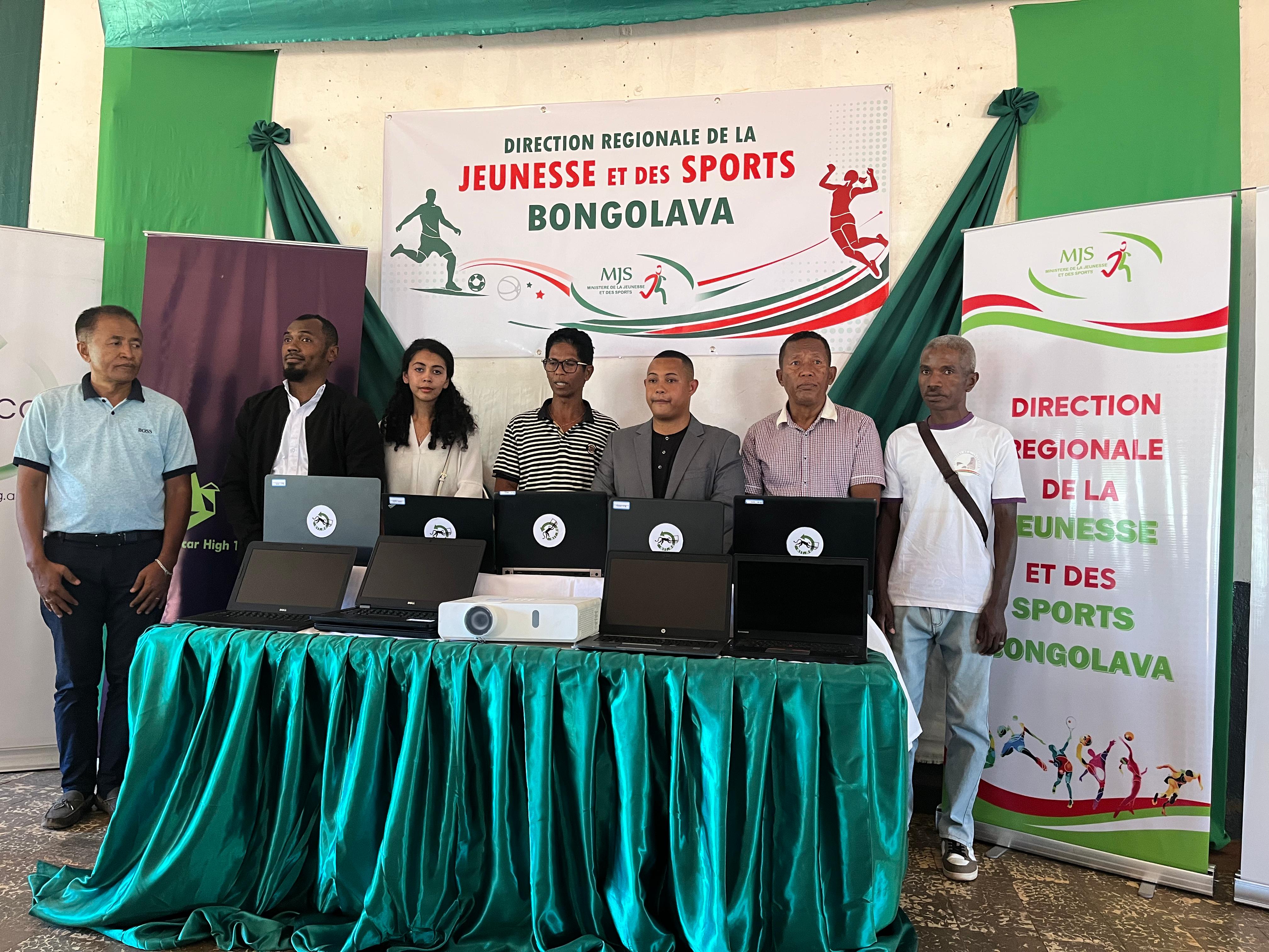 Community leaders presenting laptops and a projector through an ERA programme partnership