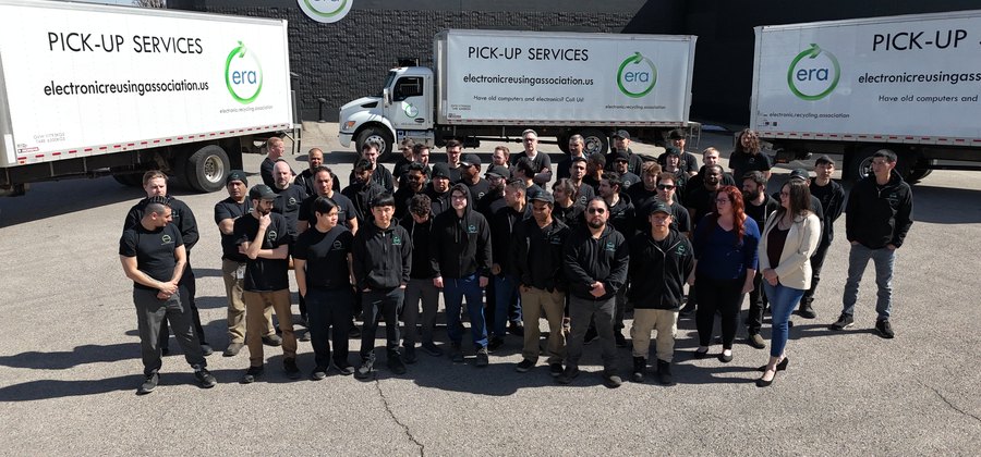 ERA team members loading retired technology for secure collection