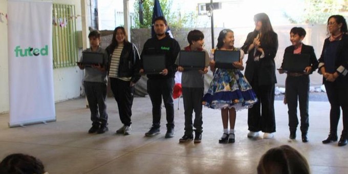 Students receiving refurbished laptops through an ERA network partner in Chile