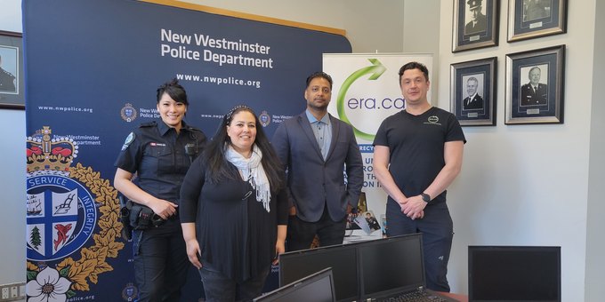 ERA and community partners gathered around donated computer equipment