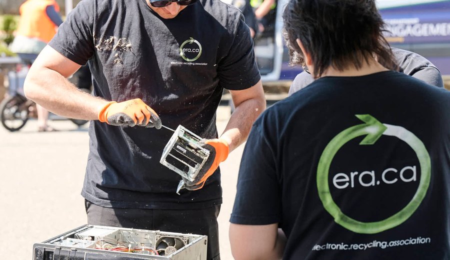 ERA technicians preparing devices at a community technology event