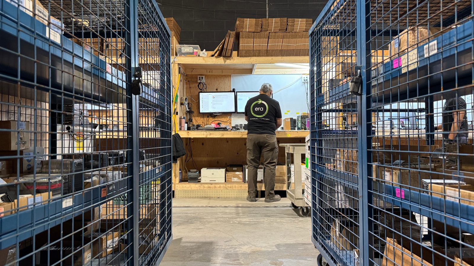 ERA technician recording equipment in a secure intake area