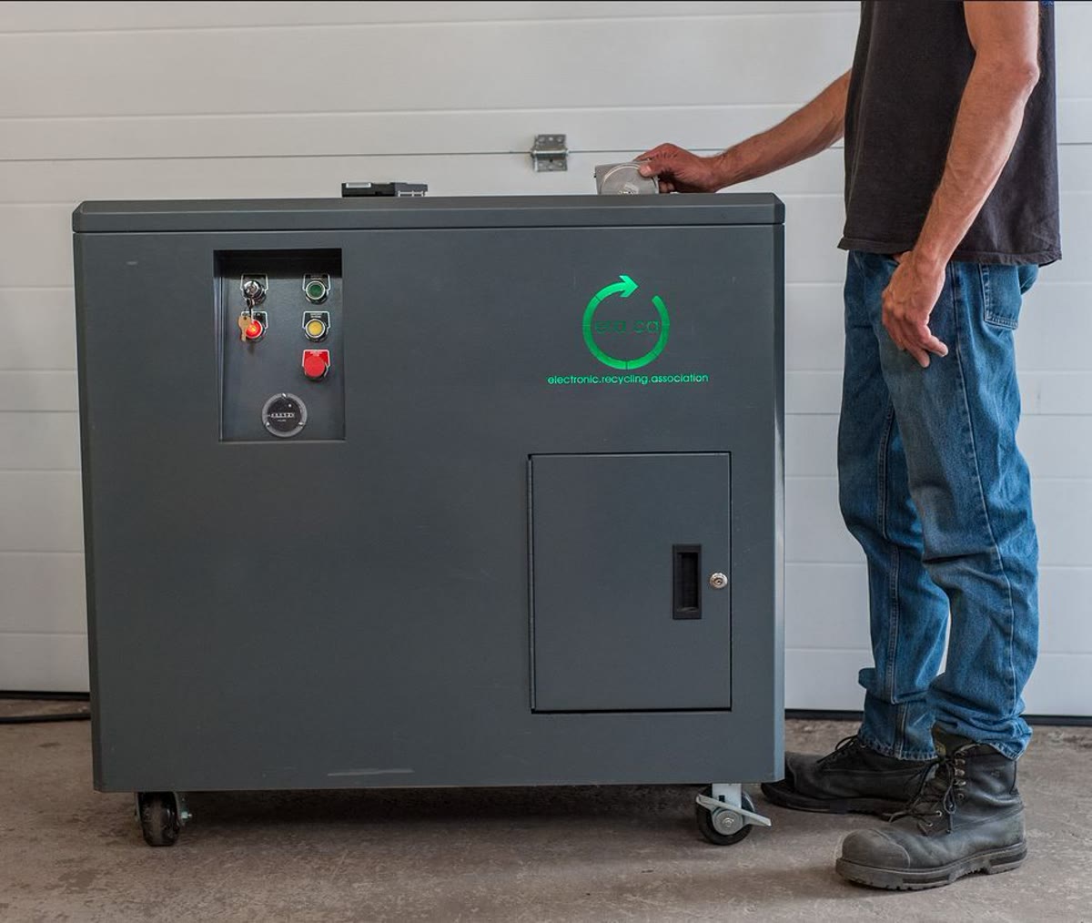 A hard drive being placed into ERA physical destruction equipment
